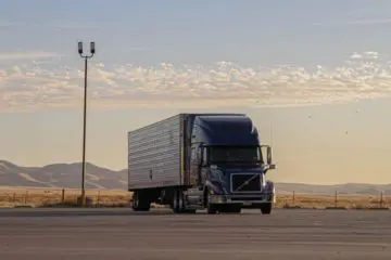 A parked tractor trailer connected to a truck using Premier Mfg hitches